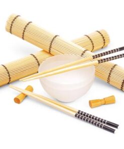 Dinner set with bamboo placemats, glass cups and chopsticks.